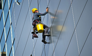 workers-comp Man cleaning windows