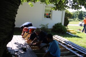People building house